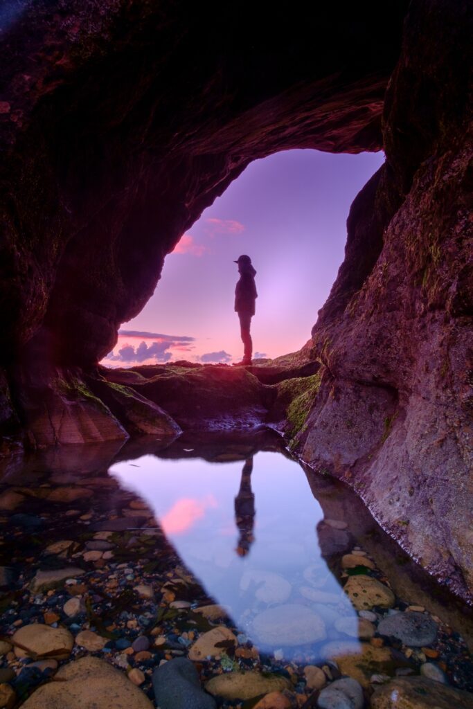 entrance-cave-person-view-sunset